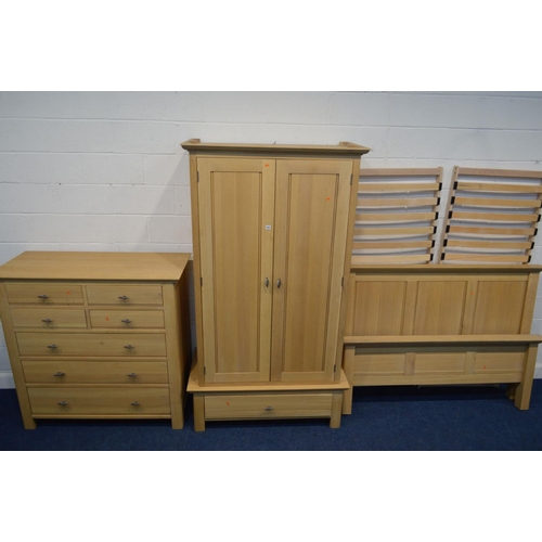 1262 - A MODERN OAK THREE PIECE BEDROOM SUITE, comprising a double door wardrobe above a single drawer, wid... 