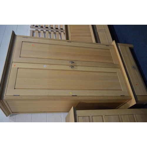 1262 - A MODERN OAK THREE PIECE BEDROOM SUITE, comprising a double door wardrobe above a single drawer, wid... 