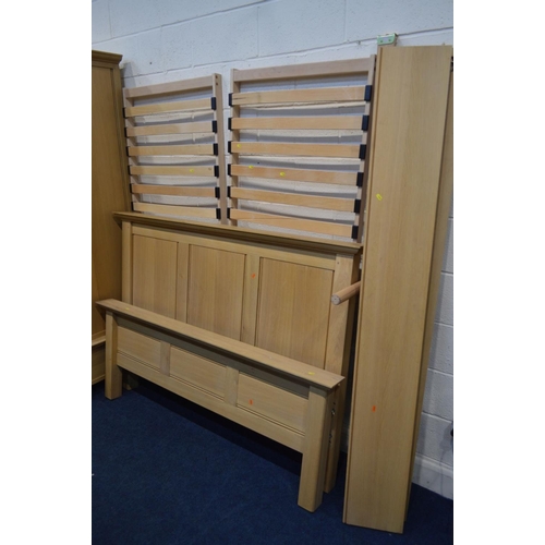 1262 - A MODERN OAK THREE PIECE BEDROOM SUITE, comprising a double door wardrobe above a single drawer, wid... 