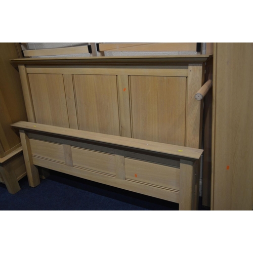 1262 - A MODERN OAK THREE PIECE BEDROOM SUITE, comprising a double door wardrobe above a single drawer, wid... 