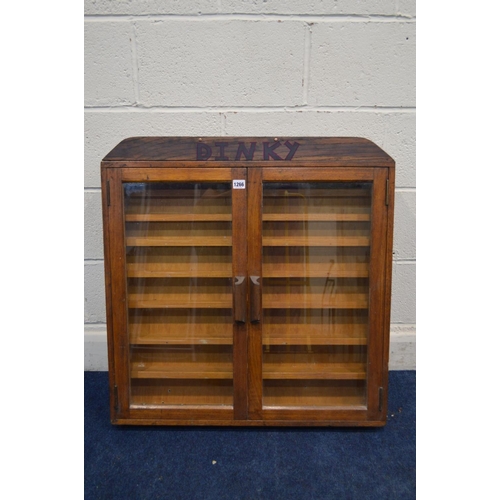 1266 - A TEAK GLAZED DOUBLE DOOR WALL HANGING DISPLAY CABINET, with later written Dinky, width 77cm x depth... 