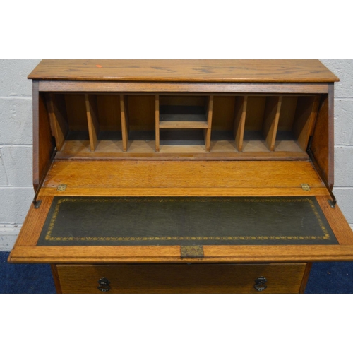 1269 - A MID 20TH CENTURY GOLDEN OAK FALL FRONT BUREAU, with a fitted interior above three drawers, width 1... 