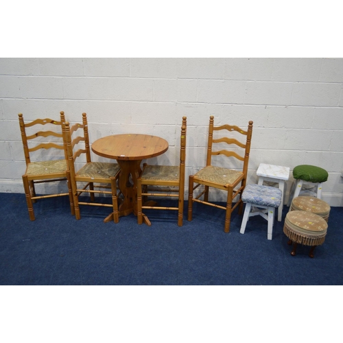 1279 - A MODERN PINE CIRCULAR KITCHEN TABLE, and four rush seated ladder back chairs (one chair with s.d.),... 