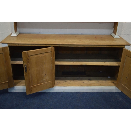 1283 - A VICTORIAN HALF PAINTED PINE DRESSER, with a triple tier plate rack and a base with triple panel do... 