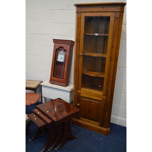 1284 - A MODERN PINE GLAZED CORNER CUPBOARD, together with a mahogany nest of tables, a modern wall clock, ... 