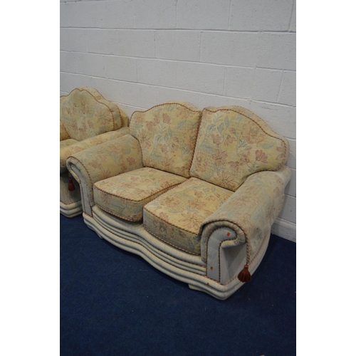 1286 - A FLORAL UPHOLSTERED TWO PIECE LOUNGE SUITE, comprising a two seater settee and an armchair (2)