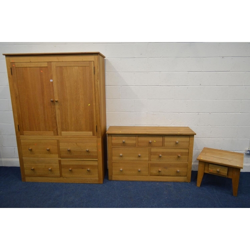 1287 - A MODERN GOLDEN OAK FIVE PIECE BEDROOM SUITE, comprising a two door wardrobe with four deep drawers,... 