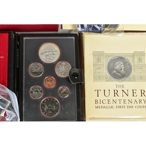 129 - A LARGE BOX OF COINS, to include six UK proof sets, a 1953 specimen set, coin covers, silver proof c... 