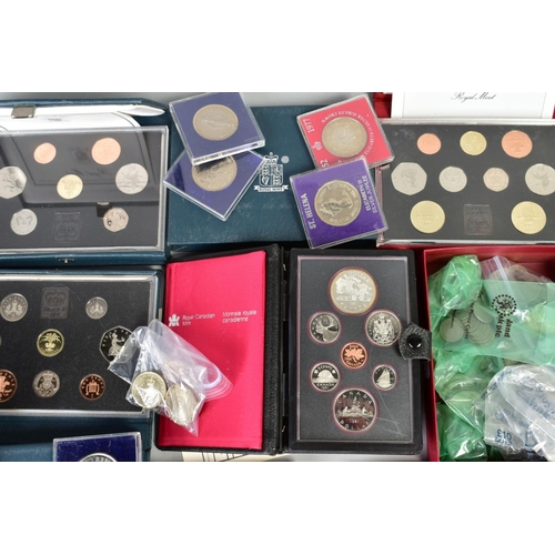 129 - A LARGE BOX OF COINS, to include six UK proof sets, a 1953 specimen set, coin covers, silver proof c... 