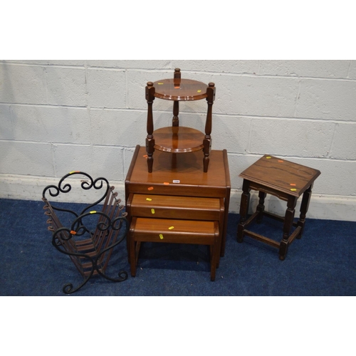 1290 - A 1970'S TEAK NEST OF THREE TABLES, together with a wrought iron magazine rack and two occasional ta... 