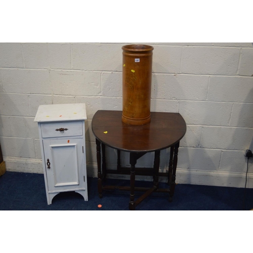 1297 - A CYLINDRICAL TURNED HARDWOOD UMBRELLA STAND, together with a mid 20th Century oak gate leg table an... 