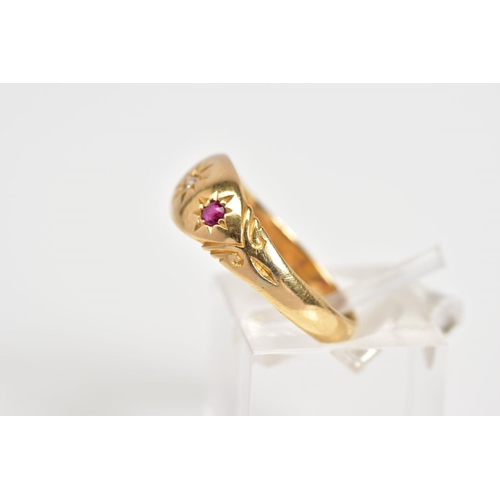 13 - AN EARLY 20TH CENTURY 18CT GOLD GYPSY RING, set with a central single cut diamond flanked by circula... 