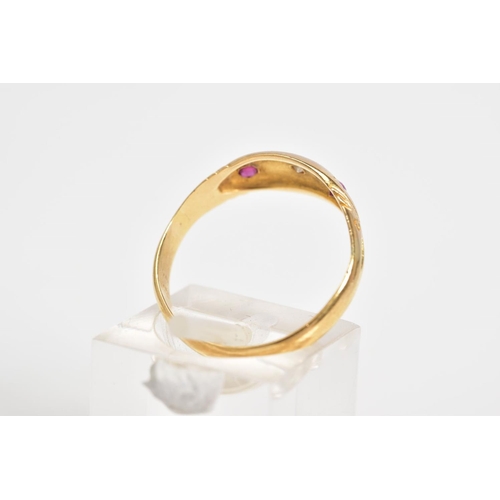 13 - AN EARLY 20TH CENTURY 18CT GOLD GYPSY RING, set with a central single cut diamond flanked by circula... 