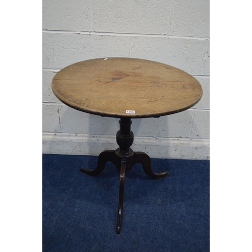 1305 - A GEORGIAN CIRCULAR SPINNING OAK TRIPOD TABLE, diameter 69cm x height 69cm