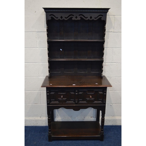 1308 - A SLIM EARLY TO MID 20TH CENTURY OAK DRESSER, with a wavy and pierced fretwork apron and similar sid... 