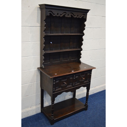 1308 - A SLIM EARLY TO MID 20TH CENTURY OAK DRESSER, with a wavy and pierced fretwork apron and similar sid... 