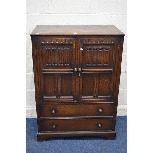 1309 - A REPRODUCTION OAK LINENFOLD TWO DOOR CABINET, with two drawers, width 86cm x depth 47cm x height 11... 