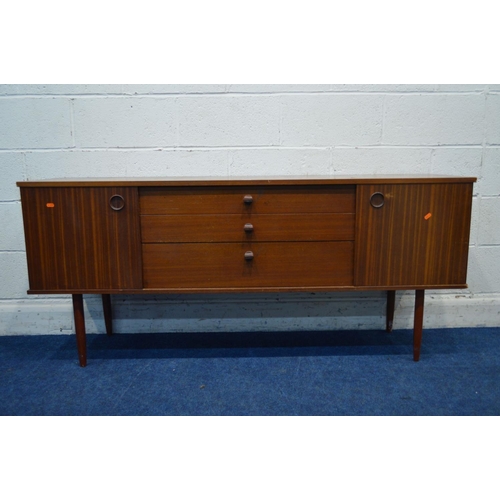 1314 - AN AVALON TEAK SIDEBOARD, with double sliding doors flanking three graduating drawers, approximate w... 