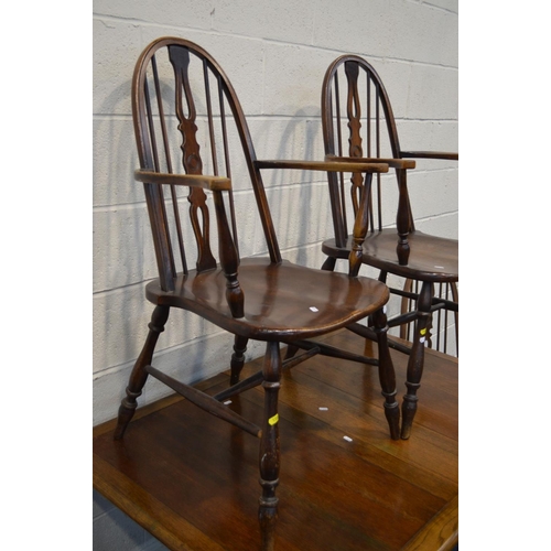 1322 - A SET OF FOUR MID 20TH CENTURY OAK SPINDLE HOOP BACK CHAIRS, including two carvers, together with an... 