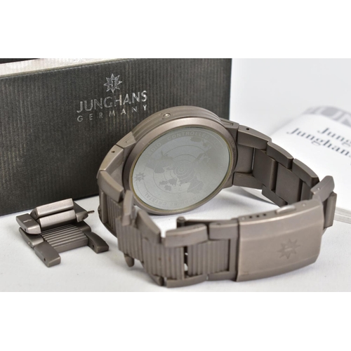 133 - A JUNGHANS RADIO CONTROLLED WRISTWATCH, black dial, titanium case and bracelet, accompanied by it's ... 