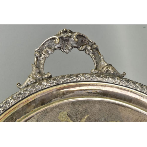 138 - A LATE VICTORIAN SILVER PLATE TWIN HANDLED TRAY OF OVAL FORM, engraved with birds and flowers, overa... 