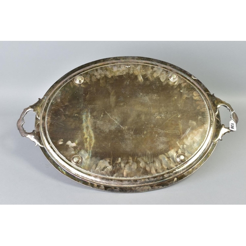 138 - A LATE VICTORIAN SILVER PLATE TWIN HANDLED TRAY OF OVAL FORM, engraved with birds and flowers, overa... 