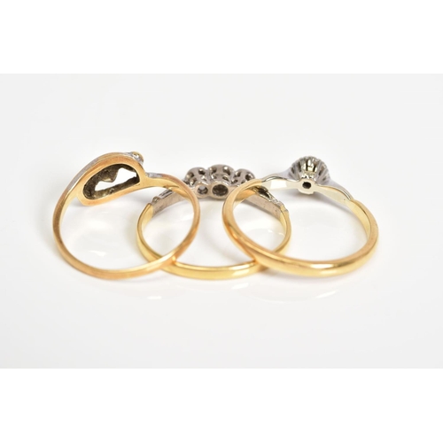 14 - THREE DIAMOND SET RINGS, the first a single stone ring set with a single cut diamond, with leaf deta... 