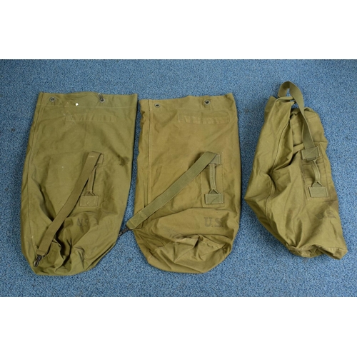 145 - THREE LARGE GREEN CANVAS WWII ERA KIT BAGS, all marked U.S, all in good condition