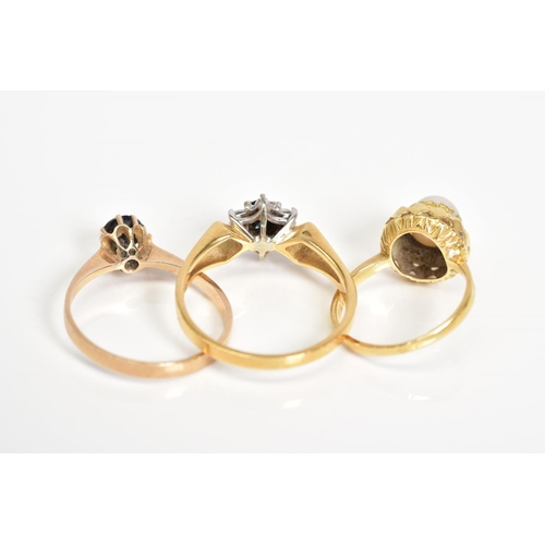 15 - THREE GEM SET RINGS, the first of cluster design set with a central circular cut sapphire with a sin... 