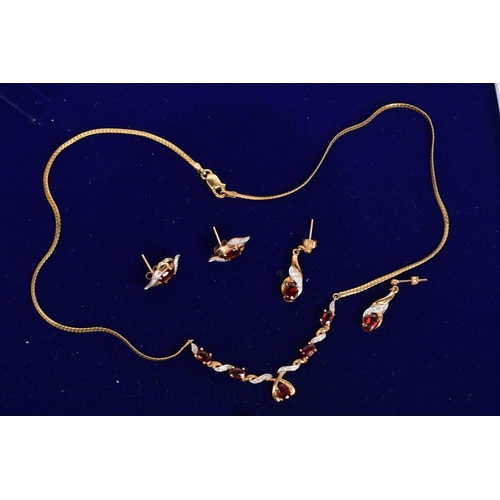 17 - A SELECTION OF 9CT GOLD GARNET AND DIAMOND SET JEWELLERY, to include a 9ct gold articulated necklace... 