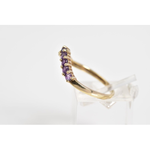 22 - A 9CT GOLD AMETHYST SET RING, of V shape design set with nine circular cut amethyst, to the plain ba... 