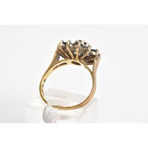 27 - A 9CT GOLD CLUSTER RING, a three tiered cluster design set with a central circular cut sapphire, sin... 