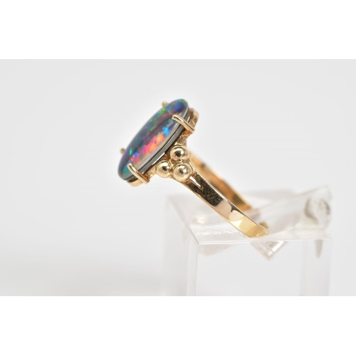 3 - AN OPAL TRIPLET RING, the oval opal triplet set within a four claw setting, to the bead detail shoul... 