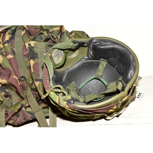 331 - A GROUP OF MILITARY/CAMOFLAGE CLOTHING AND ACCESSORIES, to include ruck sack, sleeping bag, torch, t... 