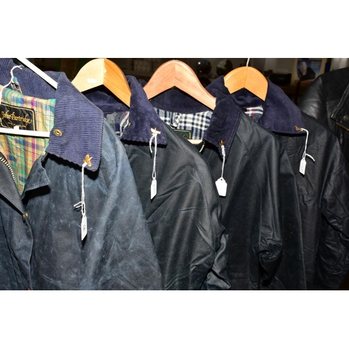 339 - FOUR NAVY BLUE WAX JACKETS by John Partridge with label attached, size 86cm, 97cm and two being 32''... 