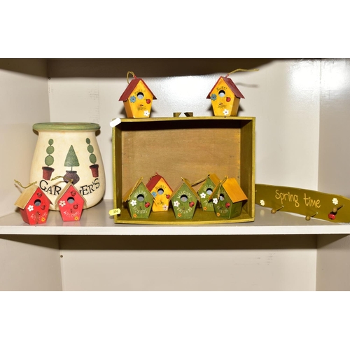 356 - NINE NOVELTY MINIATURE 'WELCOME' BIRD BOXES, a 'Springtime' coat rack, two trays, one holding trinke... 