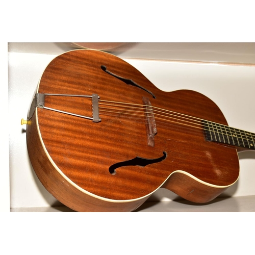 376 - AN ARCH TOP JAZZ ACOUSTIC GUITAR, with laminated top containing holes, foating rosewood bridge, nick... 