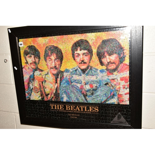 388 - A FRAMED JIGSAW PUZZLE OF THE BEATLES, a framed Yann Arthus Bertrand 'Earth from Above' print and a ... 