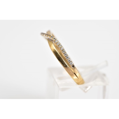 39 - A 9CT GOLD CROSSOVER RING, the crossover design set with a row of circular cut cubic zirconia to the... 