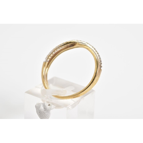 39 - A 9CT GOLD CROSSOVER RING, the crossover design set with a row of circular cut cubic zirconia to the... 