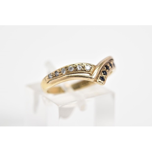 41 - A 9CT GOLD V SHAPE RING, the V shape design set with a row of circular cut sapphires and a row of ci... 