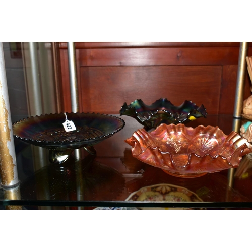 422 - TWO PURPLE CARNIVAL GLASS FOOTED DISHES, one with grape decoration, approximate diameter 23cm and th... 