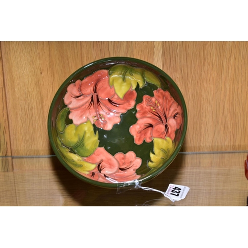 437 - A MOORCROFT POTTERY FOOTED BOWL, 'Hibiscus' pattern on green ground, impressed backstamp and painted... 