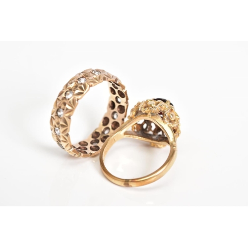 47 - TWO 9CT GOLD GEM SET RINGS, the first designed as a raised cluster set with a circular cut garnet wi... 