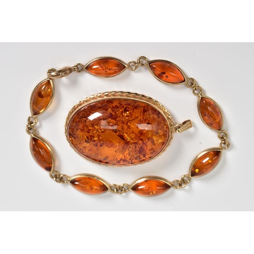 5 - A 9CT GOLD AMBER BRACELET AND PENDANT, the bracelet designed with eight lozenge shape amber links, t... 