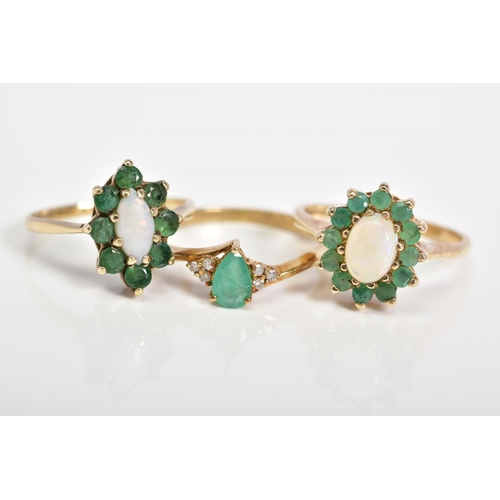 50 - THREE 9CT GOLD EMERALD SET RINGS, the first of cluster design set with an oval cut opal and circular... 