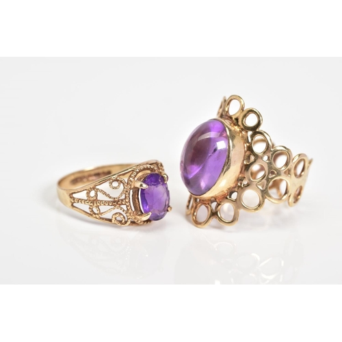 51 - TWO 9CT GOLD AMETHYST RINGS, the first designed with an oval cut amethyst and textured open work scr... 