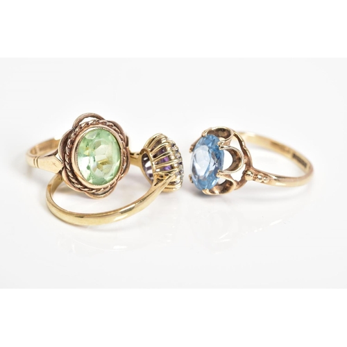 53 - THREE 9CT GOLD GEM SET RINGS, to include an oval cut topaz within a scallop surround, with a 9ct hal... 