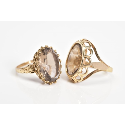 54 - TWO 9CT GOLD SMOKEY QUARTZ RINGS, the first designed with a large oval cut smokey quartz, within a s... 