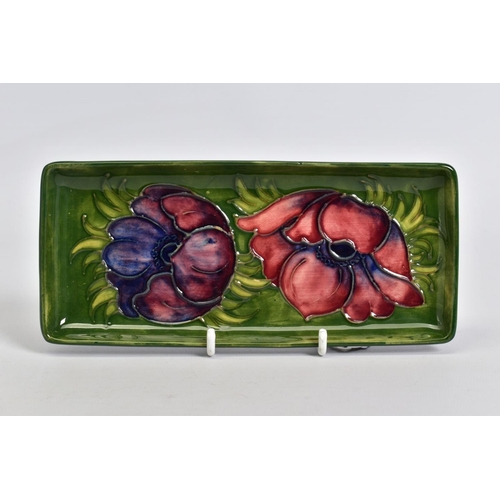 572 - A MOORCROFT POTTERY RECTANGULAR TRINKET DISH, green ground with pink/purple anemone design, impresse... 